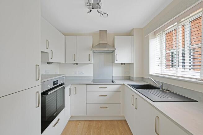 a kitchen with white cabinets