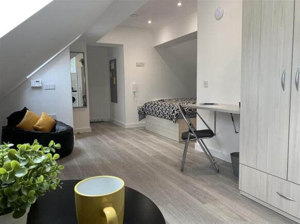 Bright modern bedroom with ample study space...