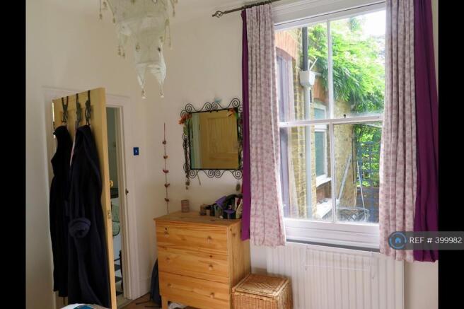 Bedroom With View Of Courtyard Garden