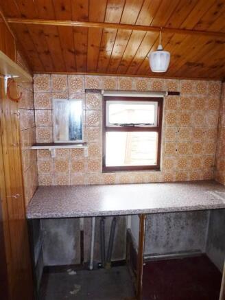 REAR PORCH AND UTILITY AREA
