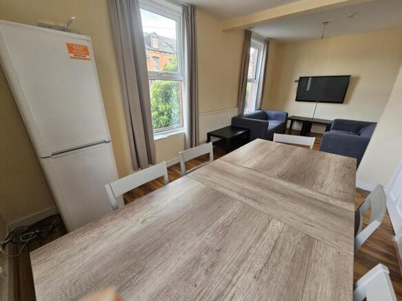 A bright and inviting living room featuring a l...