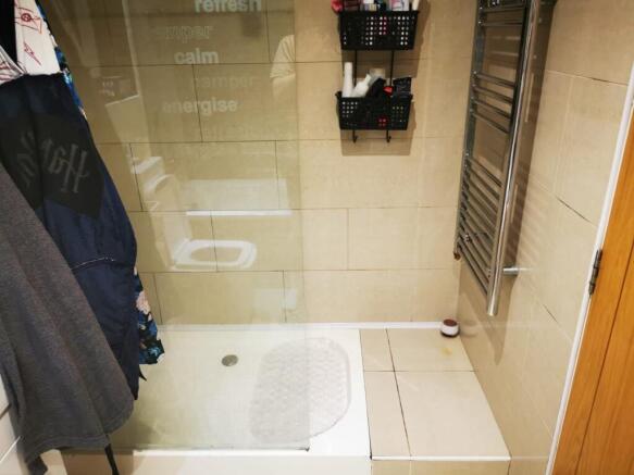 Contemporary tiled bathroom with a walk-in show...