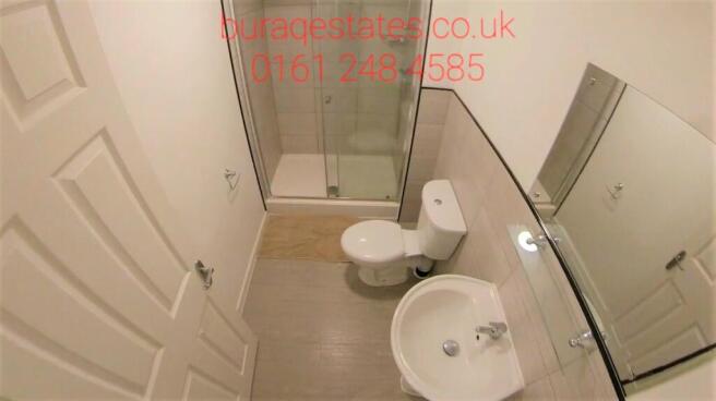 Modern bathroom with a shower enclosure, toilet...