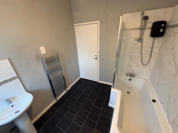 Modern Bathroom with Securely Mounted Shower.png