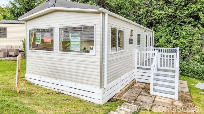 ABI Coworth Deluxe holiday home exterior with deck