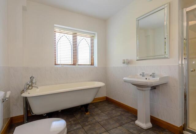 Family Bathroom With Roll Top Bath And Separate Sh