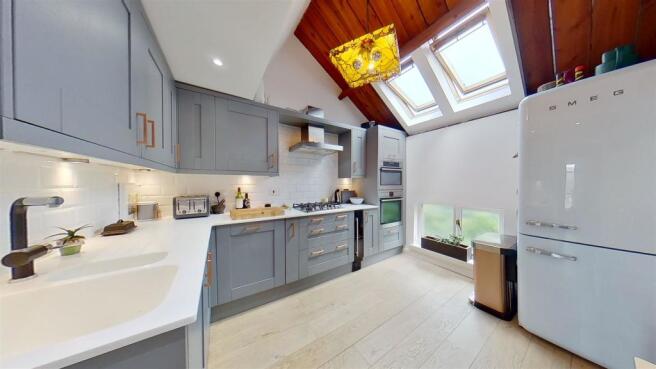 Kitchen with vaulted ceiling.jpg