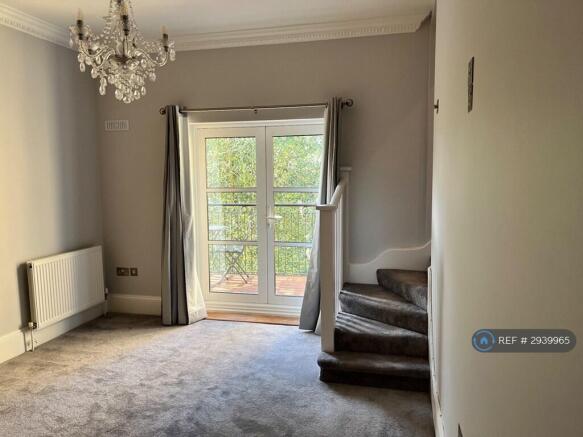 Main Bedroom With Doors To Balcony