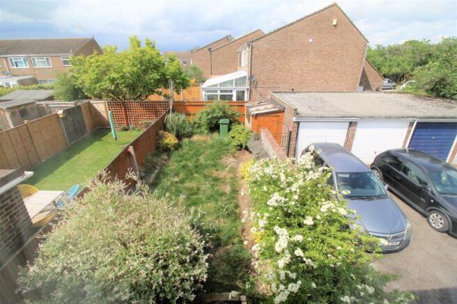 View of garden and garage