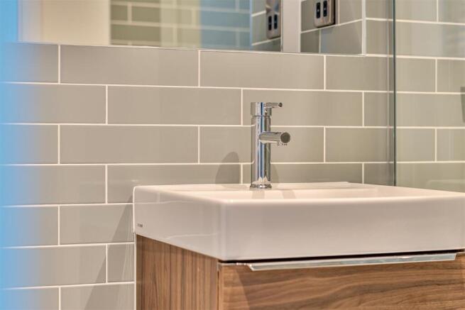 Modern bathroom with stylish tiles and vanity....