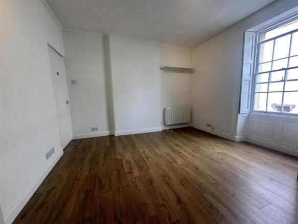 Bright airy room with beautiful wooden floors...