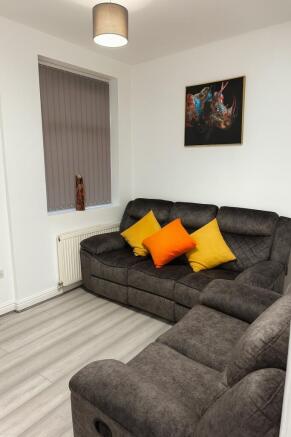 Modern small living room with a comfortable gre...