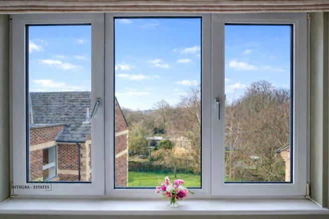 Window view over communal gardens at Homewalk Hous