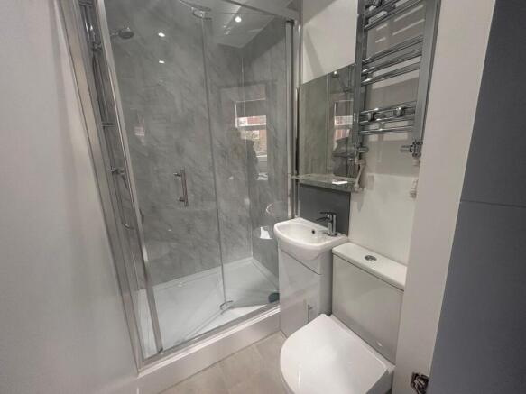 Modern tiled bathroom with shower cubicle...