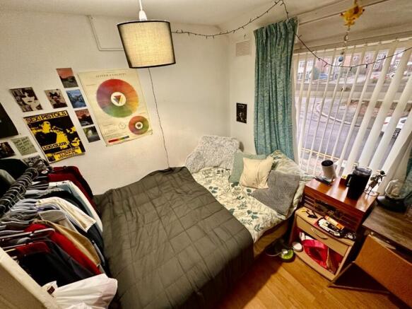 Cozy furnished bedroom with a comfortable bed, ...