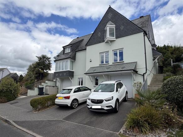 EXTERIOR SHOT WITH BLURRED NUMBER PLATES.jpg