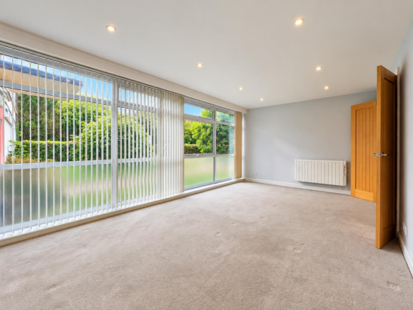 Bright Minimalist Room with Garden Views.png