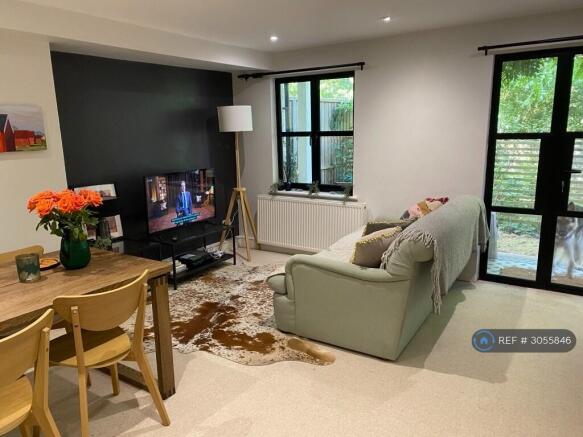 Sitting/Dining Room With French Doors To Garden