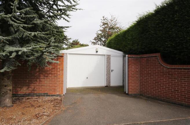 PARKING and GARAGE/WORKSHOP TO REAR