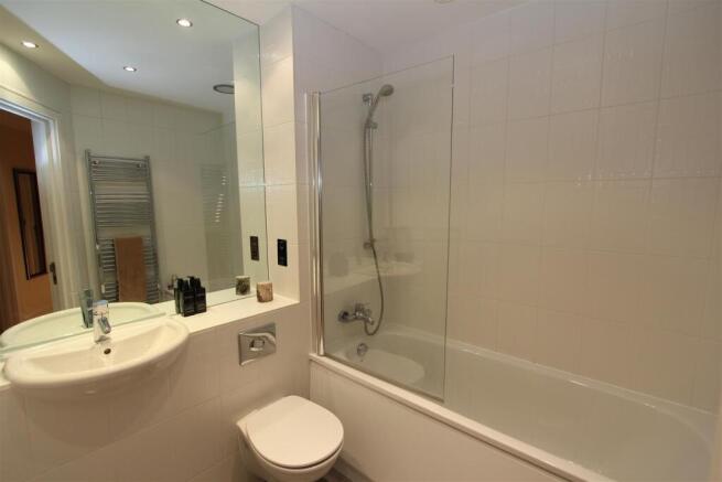 Pristine modern bathroom with large bathtub...