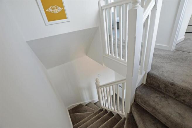 Stairway from front door to first floor