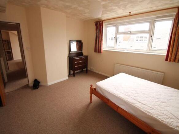 Bright, unfurnished double bedroom with a large...