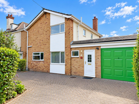 Bright Suburban Brick Home Exterior.png