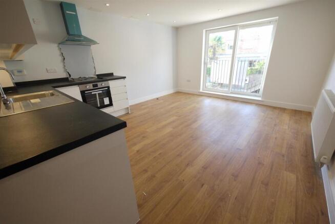 LIVING ROOM WITH OPEN PLAN KITCHEN