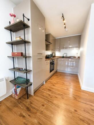 Modern gloss kitchen with stylish open shelving...