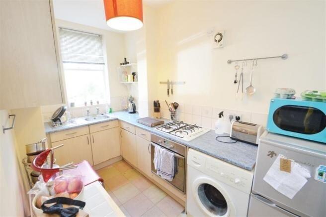 Bright, well-equipped kitchen with plenty of co...