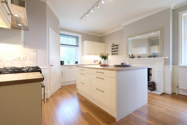 Kitchen with island & fitted appliances