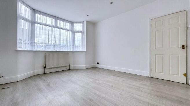 Bright master bedroom with large bay window...
