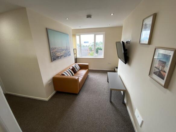 A bright and inviting living room with modern d...