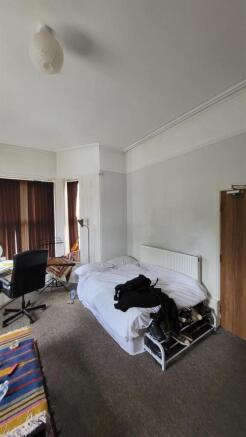 Spacious bedroom with bay window and study area...