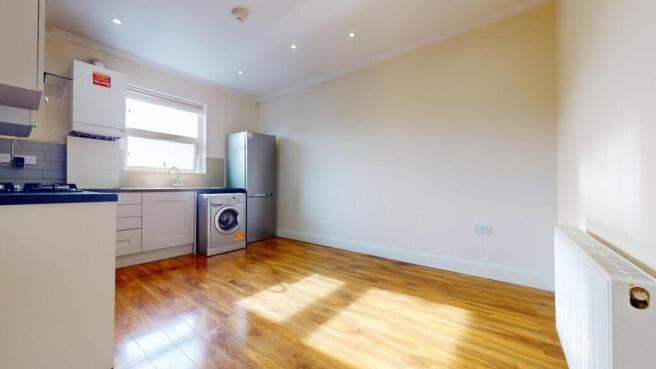 Bright open-plan kitchen with fitted cabinets, ...