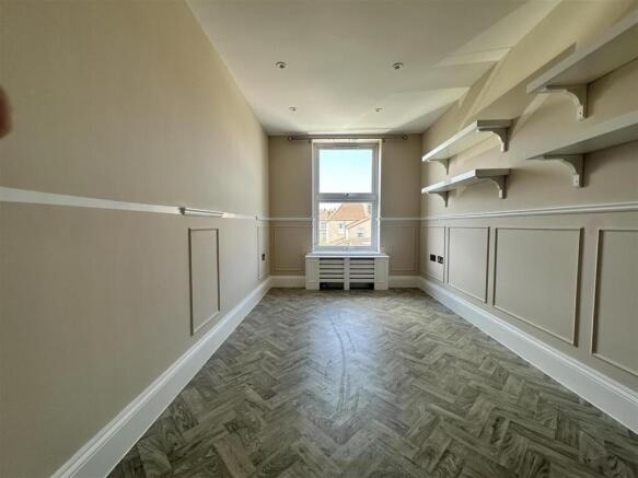 Bright workspace with elegant paneling and shel...