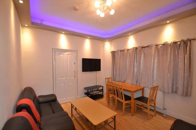 A stylish, well-lit living room featuring a con...
