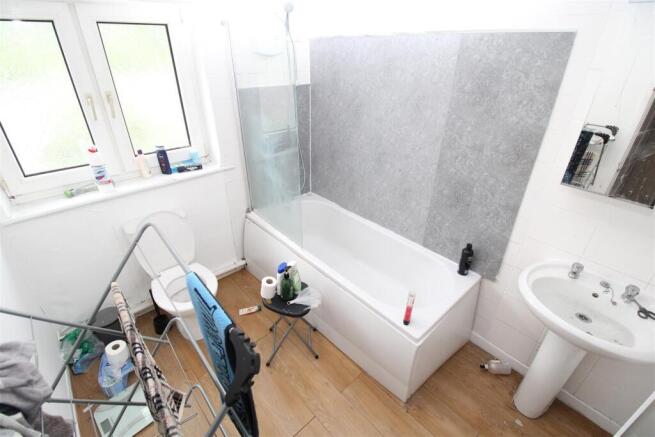 Bright bathroom featuring a full-size bath....