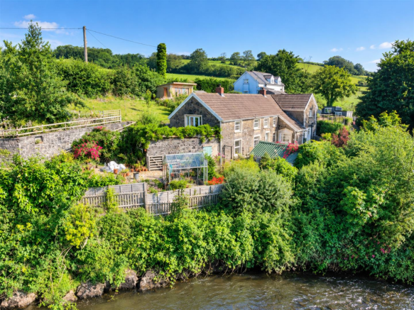 Idyllic Cottage Garden by the Stream.png