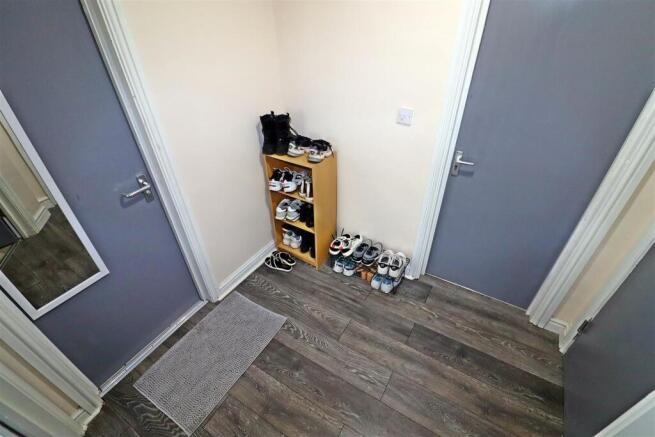 Bright hallway with modern wood-effect flooring...