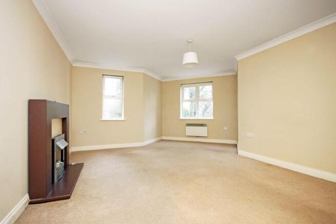 Spacious and bright living area with fireplace....