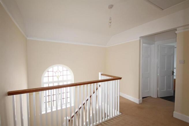 Stairs rising to first floor landing