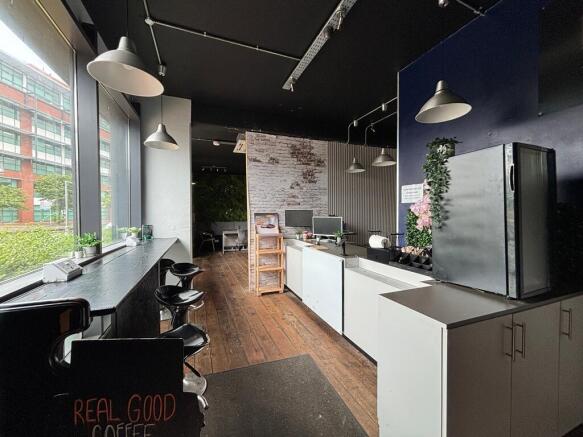 Modern reception with coffee bar and bright win...