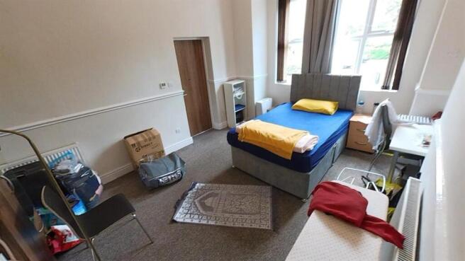 Spacious double bedroom with large windows...