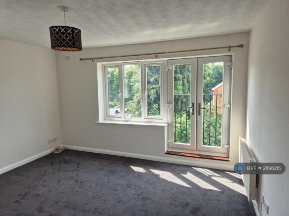 Livingroom With Large Window And Juliet Balcony