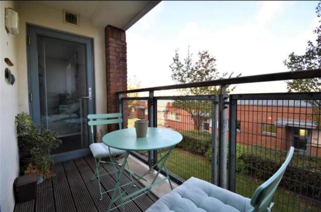 Private balcony with charming bistro seating...