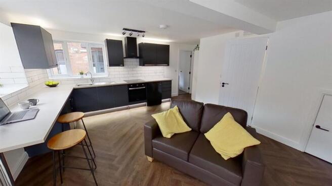 Modern open-plan kitchen with breakfast bar...