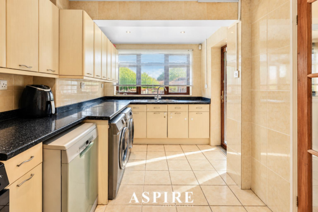 Sunlit Modern Galley Kitchen.png