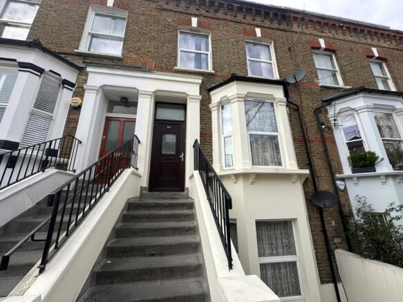 Classic terraced house with bay window and rais...