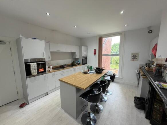 Modern kitchen with island and breakfast bar...